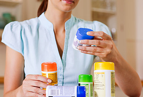 getty_rf_photo_of_woman_looking_at_supplements